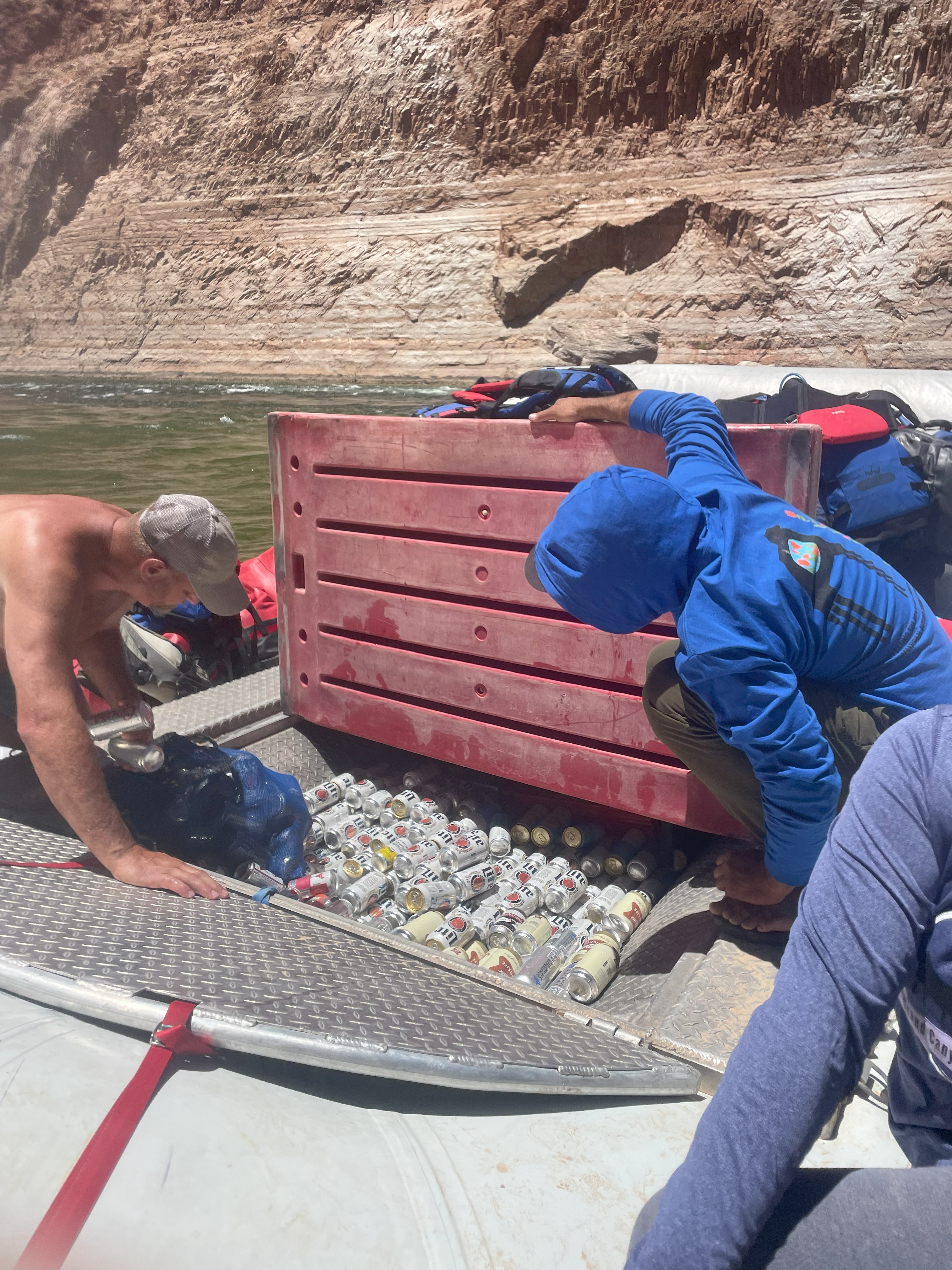 The bow hold, filled with beer cans